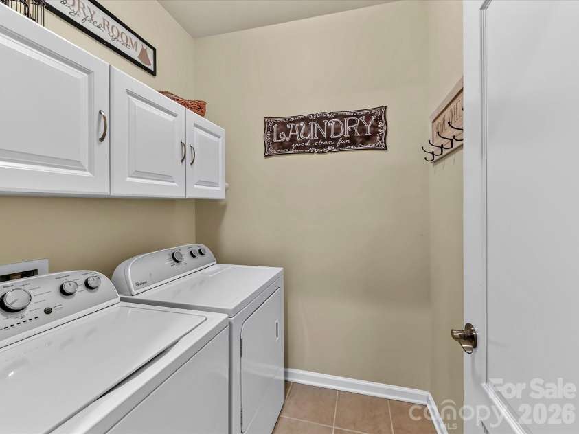 9005 Cape Breton Lane, Lancaster, SC 29720.  MLS# CAR4416986, YatesRealty ID 47740. Laundry with Upper Cabinets and Tiled Flooring