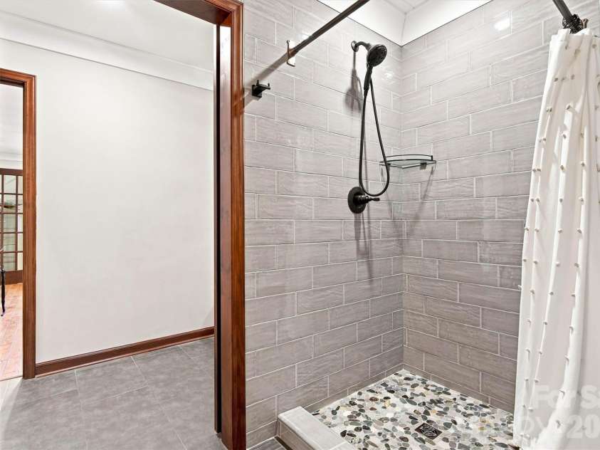 3867 Angie Drive, Denver, NC 28037.  MLS# CAR4413500, YatesRealty ID 47745. Full custom tile shower makes showering after enjoying the pool a breeze!  Also good for dog baths!