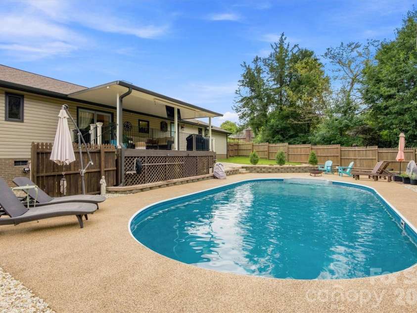 3867 Angie Drive, Denver, NC 28037.  MLS# CAR4413500, YatesRealty ID 47745. Gorgeous hardscaping and landscaping make this back yard a real oasis! Solar heated pool can be enjoyed well into the cooler months!
