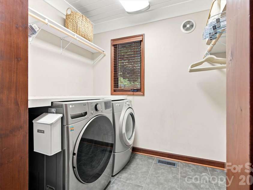 3867 Angie Drive, Denver, NC 28037.  MLS# CAR4413500, YatesRealty ID 47745. Laundry Room with shelving and hanging rods is spacious.