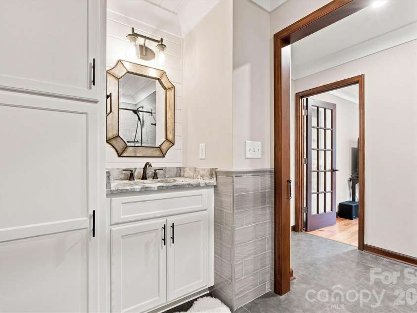 3867 Angie Drive, Denver, NC 28037.  MLS# CAR4413500, YatesRealty ID 47745. Mudroom Bath is completely custom and provides access from/to the pool area!