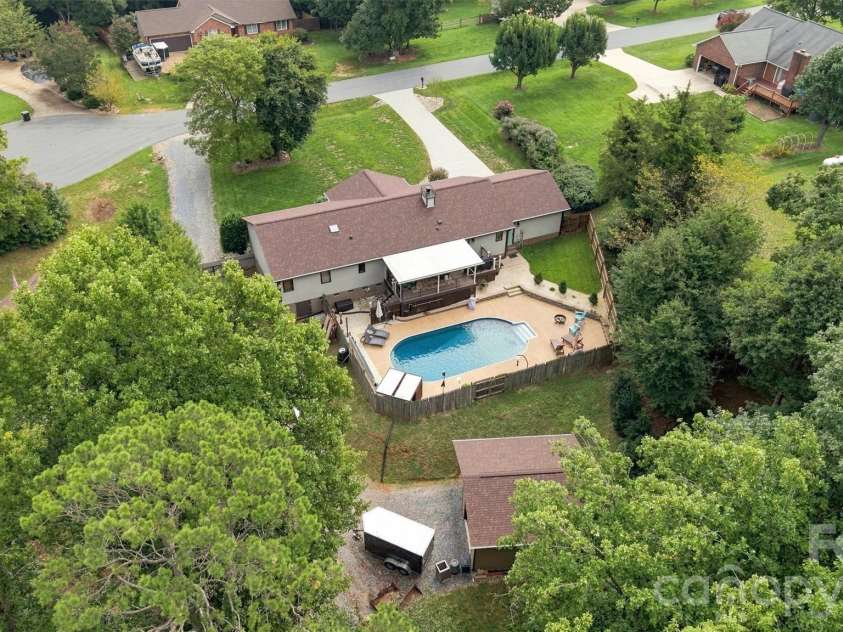 3867 Angie Drive, Denver, NC 28037.  MLS# CAR4413500, YatesRealty ID 47745. This property has been created to utilize the space wisely. Detached garage/workshop is hidden behind the home and pool area, completely out of sight.