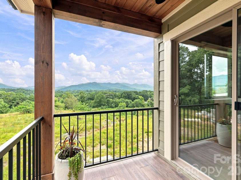 128 Chepstow Place, Black Mountain, NC 28711.  MLS# CAR4415709, YatesRealty ID 47759. Upper level Primary Bedroom Deck