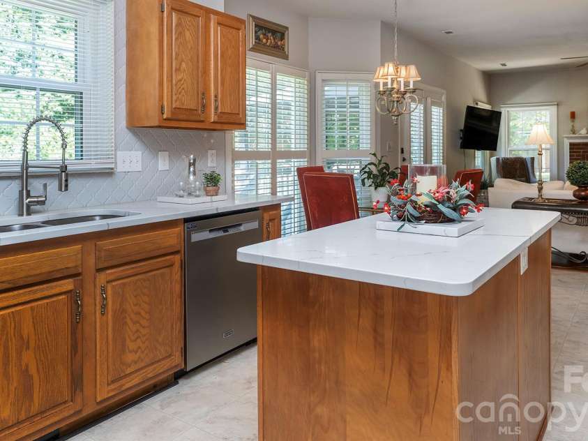 4314 Silvermere Way, Charlotte, NC 28269.  MLS# CAR4417932, YatesRealty ID 47777. Kitchen looking into family room