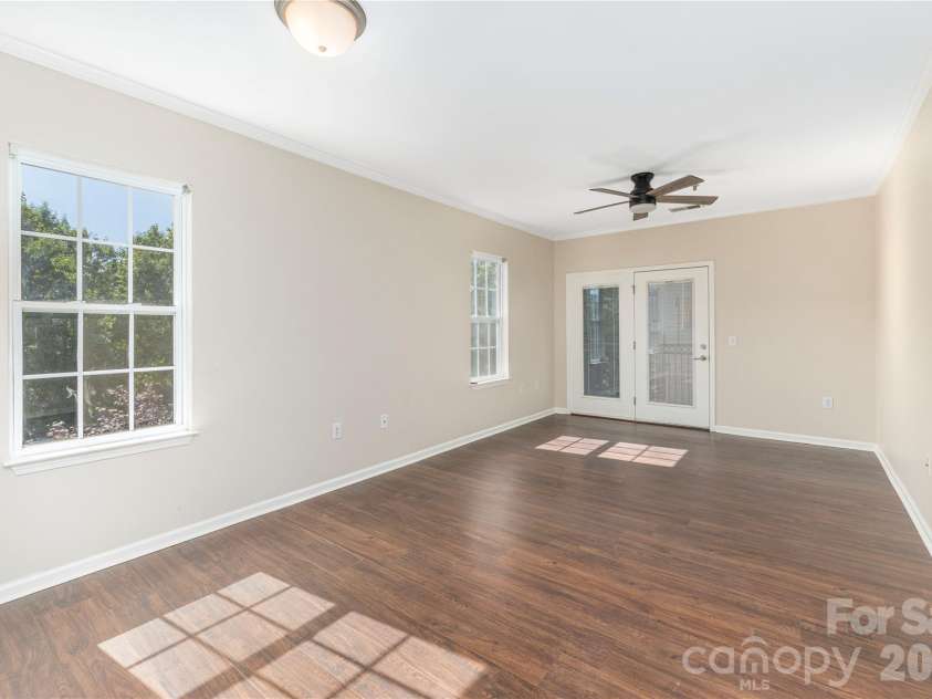 331 Appeldoorn Circle, Asheville, NC 28803.  MLS# CAR4418099, YatesRealty ID 47778. Open living dining space, with doors out to the covered back deck.