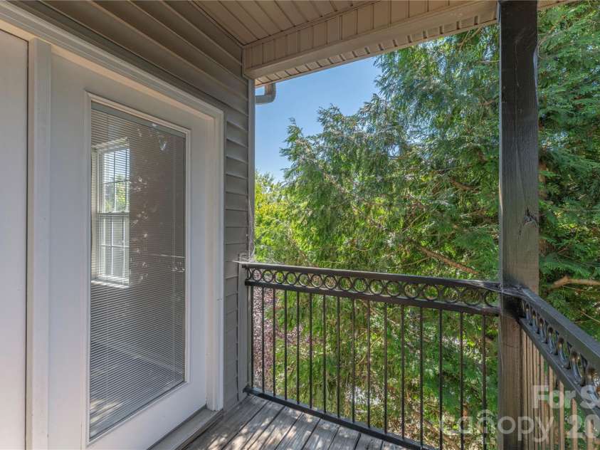 331 Appeldoorn Circle, Asheville, NC 28803.  MLS# CAR4418099, YatesRealty ID 47778. Private treehouse feeling back deck.