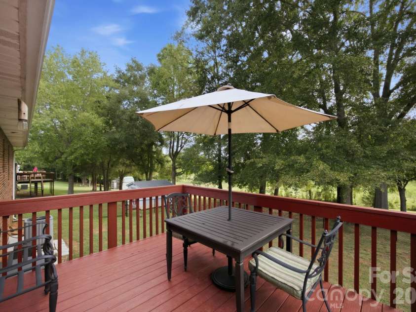 105 Ashburne Drive, Shelby, NC 28152.  MLS# CAR4419130, YatesRealty ID 47781. Back deck looks out over fenced backyard and a pasture