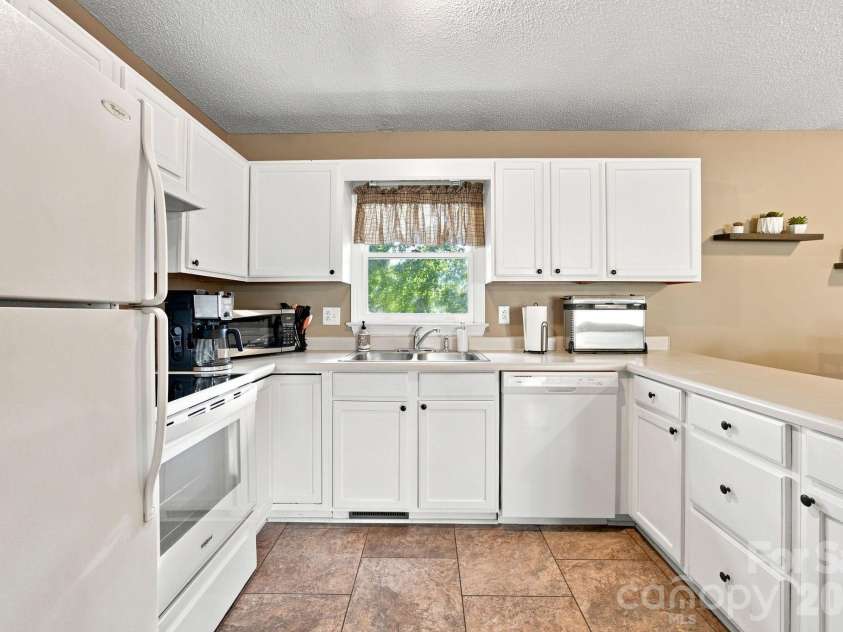 105 Ashburne Drive, Shelby, NC 28152.  MLS# CAR4419130, YatesRealty ID 47781. Window over the sink looking toward the backyard