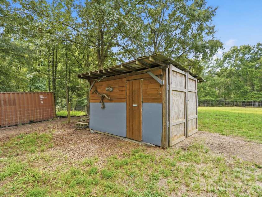 205 Airport Road, Wesley Chapel, NC 28110.  MLS# CAR4418065, YatesRealty ID 47810. 2 more storage sheds