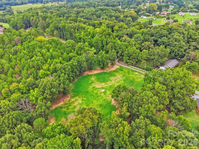 205 Airport Road, Wesley Chapel, NC 28110.  MLS# CAR4418065, YatesRealty ID 47810. Look at that land