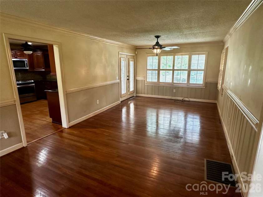 501 Main Street, Jefferson, SC 29718.  MLS# CAR4418845, YatesRealty ID 47814. Den looking from dining area towards kitchen