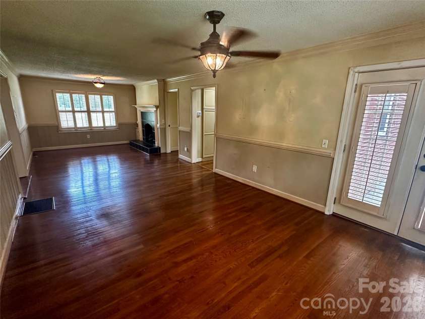 501 Main Street, Jefferson, SC 29718.  MLS# CAR4418845, YatesRealty ID 47814. Den/Dining area  with fireplace.  Access to the large rear deck.