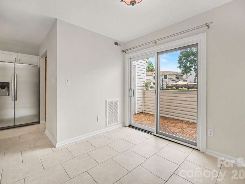 11009 Carmel Crossing Road, Charlotte, NC 28226.  MLS# CAR4408434, YatesRealty ID 47823. Dining area also has a partial pool view