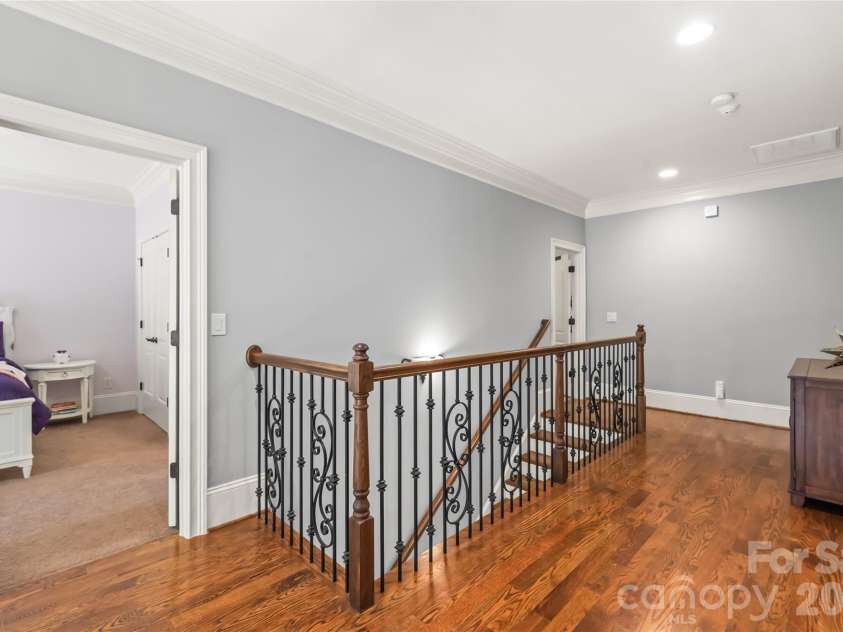 7320 Summerlin Place, Charlotte, NC 28226.  MLS# CAR4418024, YatesRealty ID 47825. The second level features four spacious bedrooms, a convenient laundry room, and a versatile bonus space ideal for movie and game nights.