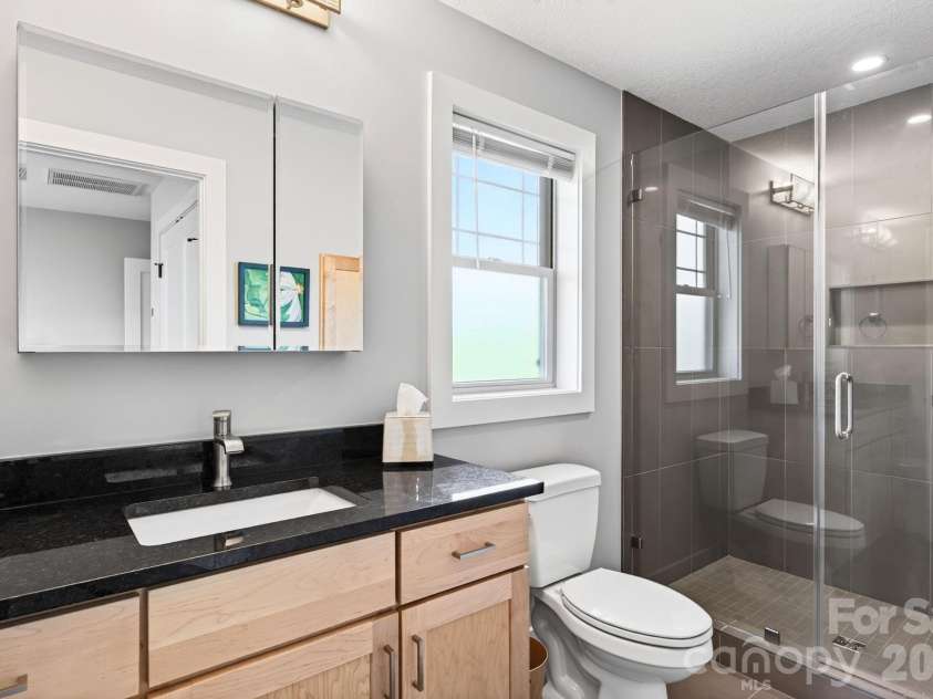 16 Britton Knoll Pass, Arden, NC 28704.  MLS# CAR4417470, YatesRealty ID 47841. Upstairs Guest Bathroom