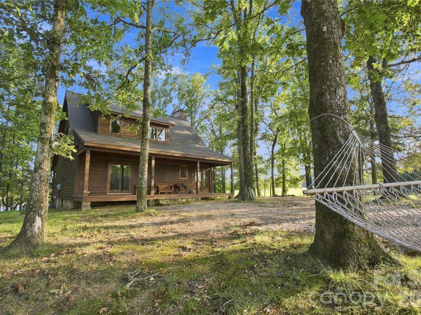 1979 Willie Usher Road, Lancaster, SC 29720.  MLS# CAR4410738, YatesRealty ID 47845. Covered back porch overlooking pasture