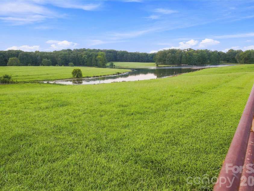 1979 Willie Usher Road, Lancaster, SC 29720.  MLS# CAR4410738, YatesRealty ID 47845. Pasture and pond views looking toward homesite
