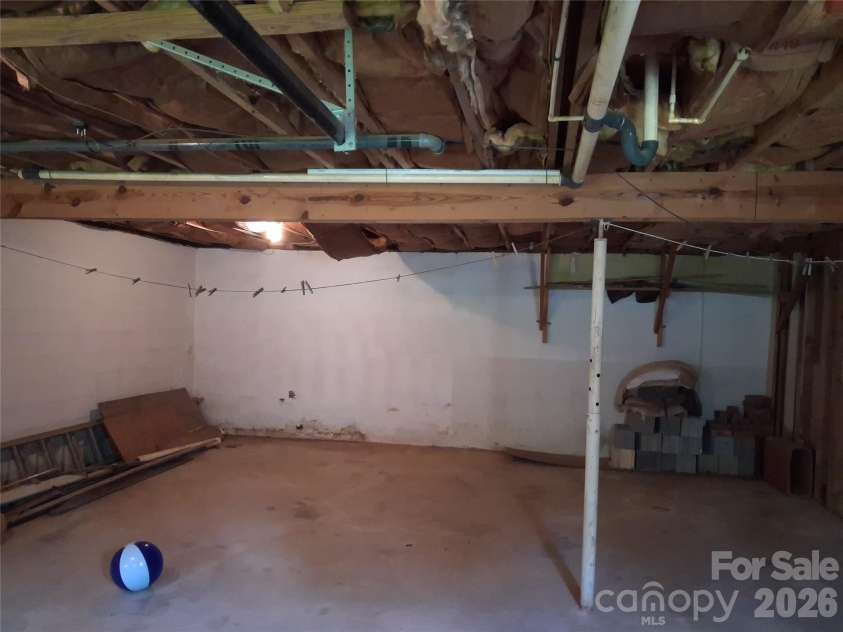 114 Ashworth Circle, Marion, NC 28752.  MLS# CAR4419710, YatesRealty ID 47852. Basement workshop/storage area