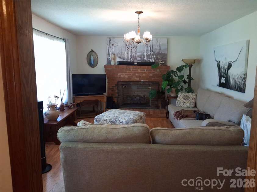 114 Ashworth Circle, Marion, NC 28752.  MLS# CAR4419710, YatesRealty ID 47852. Living Room w/cozy fireplace