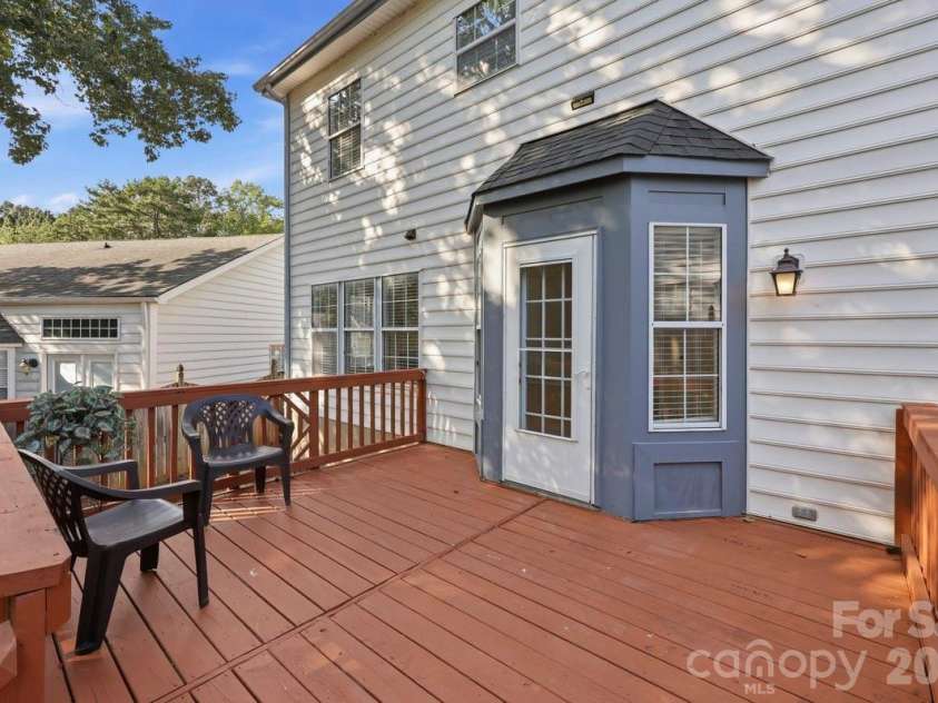 14230 Quartz Lane, Pineville, NC 28134.  MLS# CAR4419723, YatesRealty ID 47864. BACK DECK ENTRANCE TO BAY KITCHEN