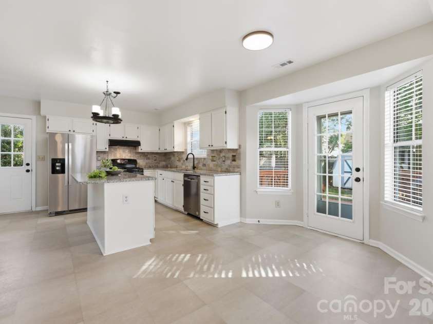 14230 Quartz Lane, Pineville, NC 28134.  MLS# CAR4419723, YatesRealty ID 47864. BAY AREA KITCHEN WINDOW AREA OVERLOOKING DECK