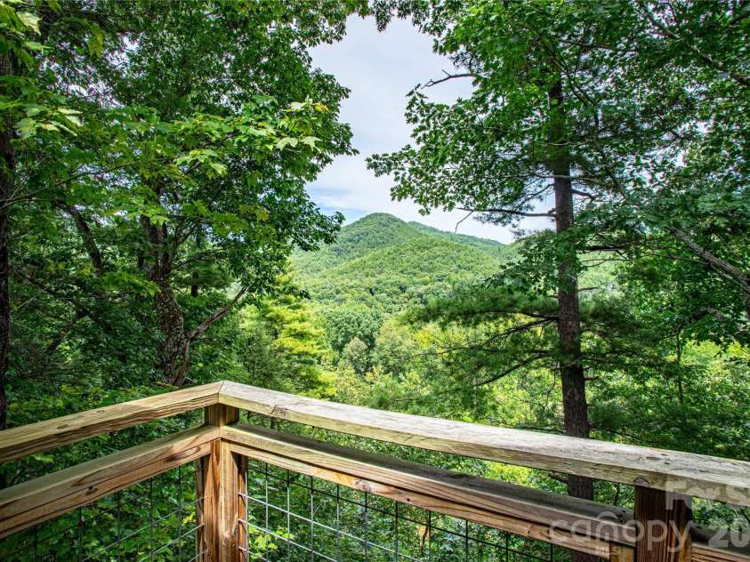 1295 Paint Rock Road, Hot Springs, NC 28743.  MLS# CAR4416316, YatesRealty ID 47874. Cabin deck