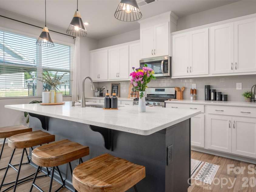 2538 Crimson Way, Monroe, NC 28112.  MLS# CAR4418315, YatesRealty ID 47877. Oversized center  island offers extra seating or work space