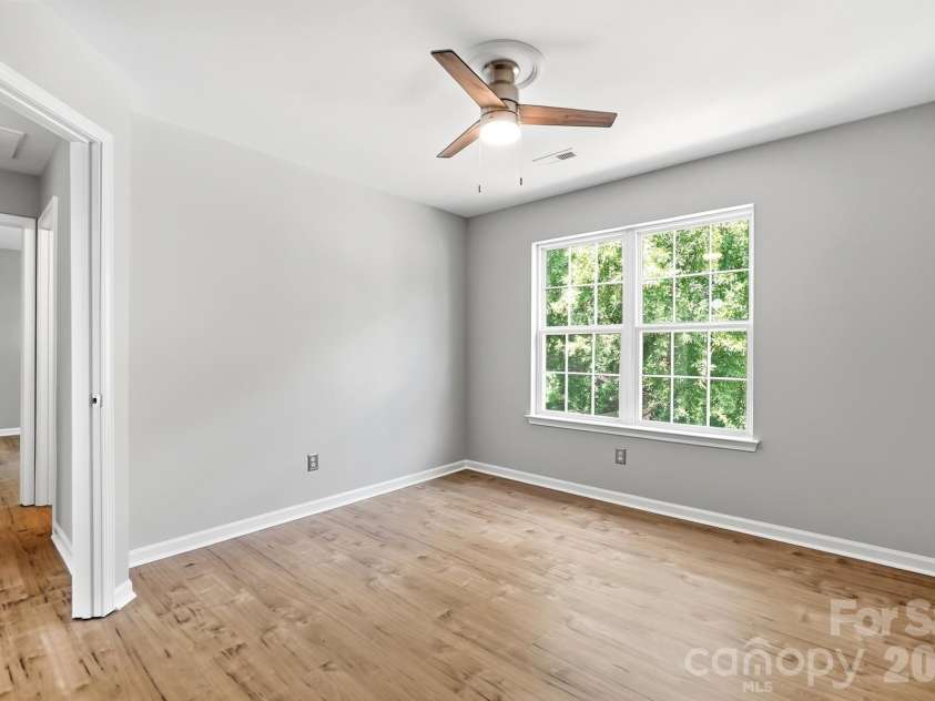 11402 Heritage Green Drive, Cornelius, NC 28031.  MLS# CAR4413381, YatesRealty ID 47889. Guest Room #2 overlooks backyard
