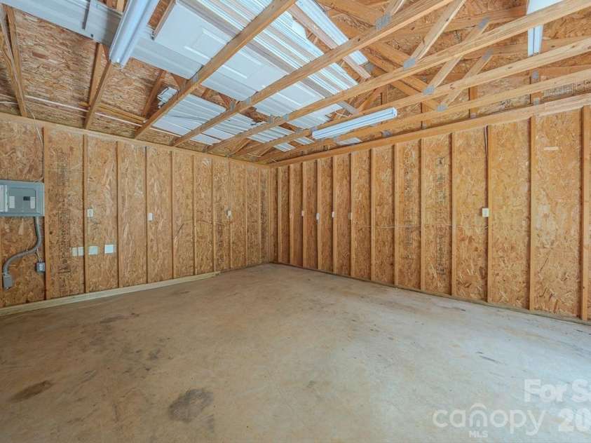 163 Meadowbrook Lane, Marion, NC 28752.  MLS# CAR4417340, YatesRealty ID 47903. Inside of workshop