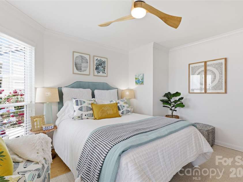 932 Southwest Drive, Davidson, NC 28036.  MLS# CAR4414444, YatesRealty ID 47906. Relaxing primary bedroom with space to unwind.