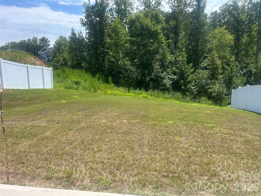 5021 Poplin Valley, Cherryville, NC 28021.  MLS# CAR4419741, YatesRealty ID 47918. Backyard primarily flat