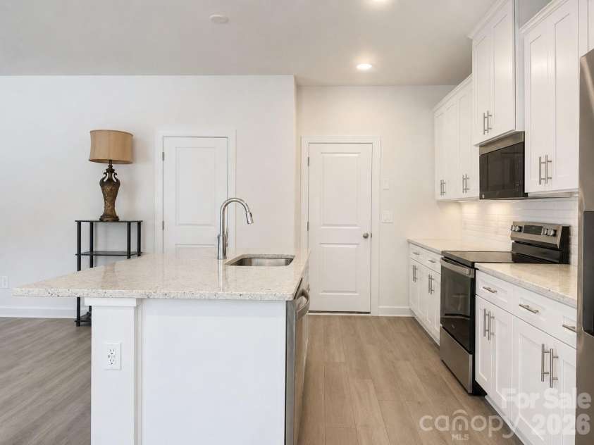 5021 Poplin Valley, Cherryville, NC 28021.  MLS# CAR4419741, YatesRealty ID 47918. Kitchen with island that includes the sink and dishwasher