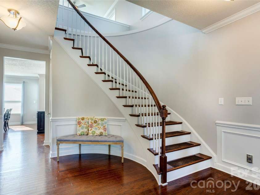 255 Perennial Drive, Concord, NC 28027.  MLS# CAR4417851, YatesRealty ID 47934. Beautiful curved staircase.