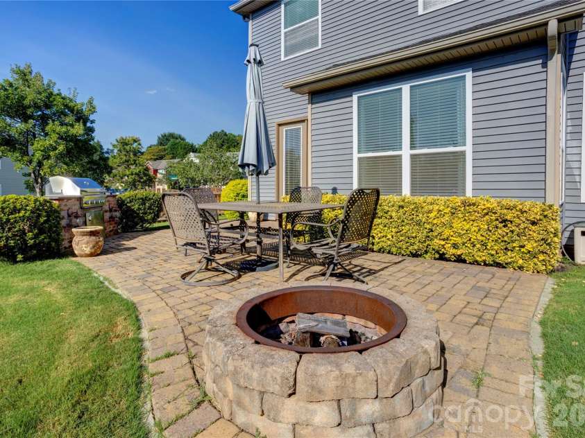 255 Perennial Drive, Concord, NC 28027.  MLS# CAR4417851, YatesRealty ID 47934. Enjoy the firepit, also on the expansive patio!