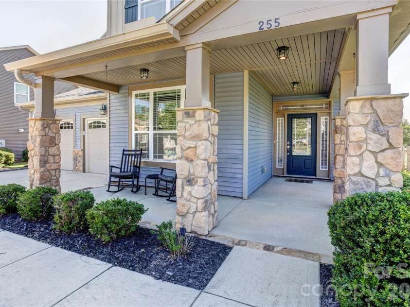 255 Perennial Drive, Concord, NC 28027.  MLS# CAR4417851, YatesRealty ID 47934. Inviting wrap around porch.