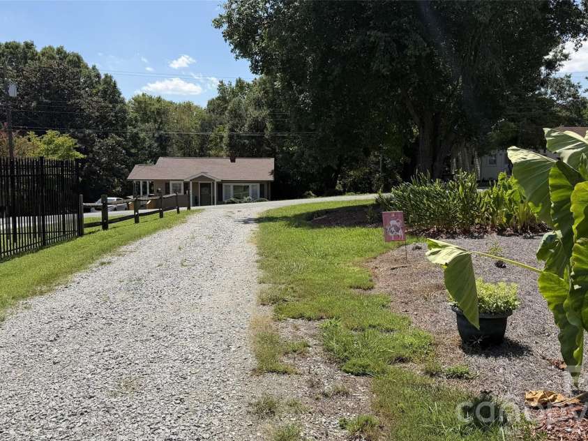 209 Auten Circle, Mount Holly, NC 28120.  MLS# CAR4414320, YatesRealty ID 47945. Driveway looking toward Auten circle