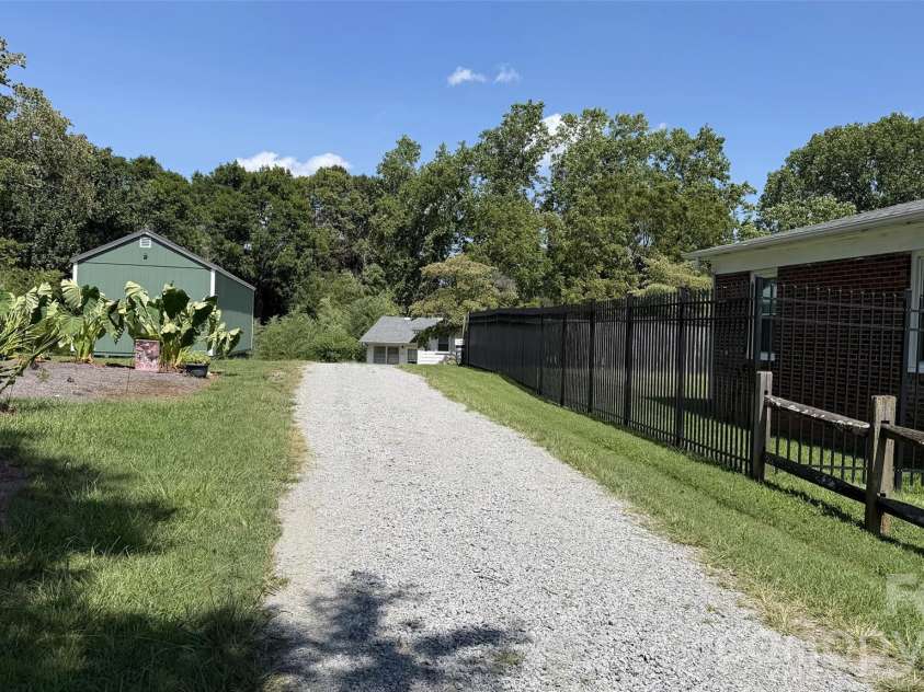209 Auten Circle, Mount Holly, NC 28120.  MLS# CAR4414320, YatesRealty ID 47945. Driveway view from Auten Circle