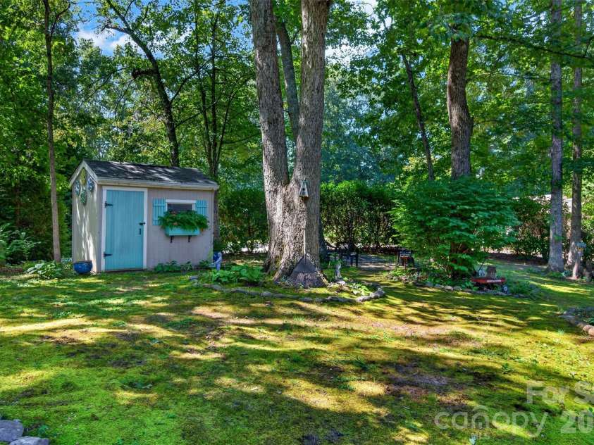 42 Timothy Lane, Candler, NC 28715.  MLS# CAR4419868, YatesRealty ID 47953. Functional garden shed