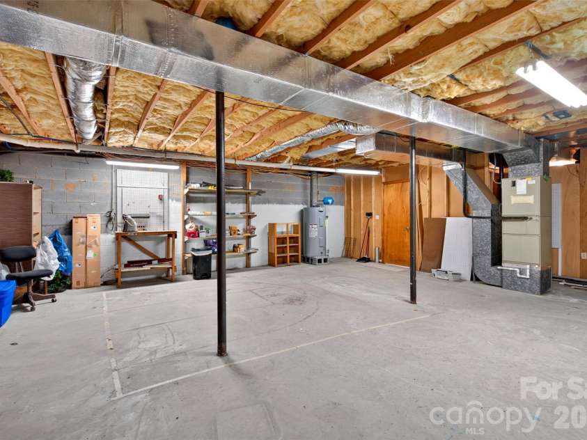 42 Timothy Lane, Candler, NC 28715.  MLS# CAR4419868, YatesRealty ID 47953. Generous storage space and potential workshop area