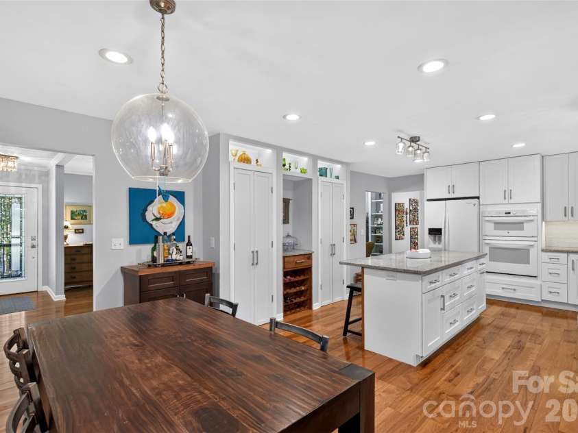 42 Timothy Lane, Candler, NC 28715.  MLS# CAR4419868, YatesRealty ID 47953. Lighting quality and placement accent built-in kitchen cabinetry