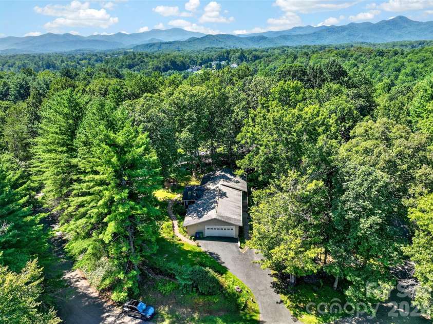 42 Timothy Lane, Candler, NC 28715.  MLS# CAR4419868, YatesRealty ID 47953. Mature tree canopy abounds