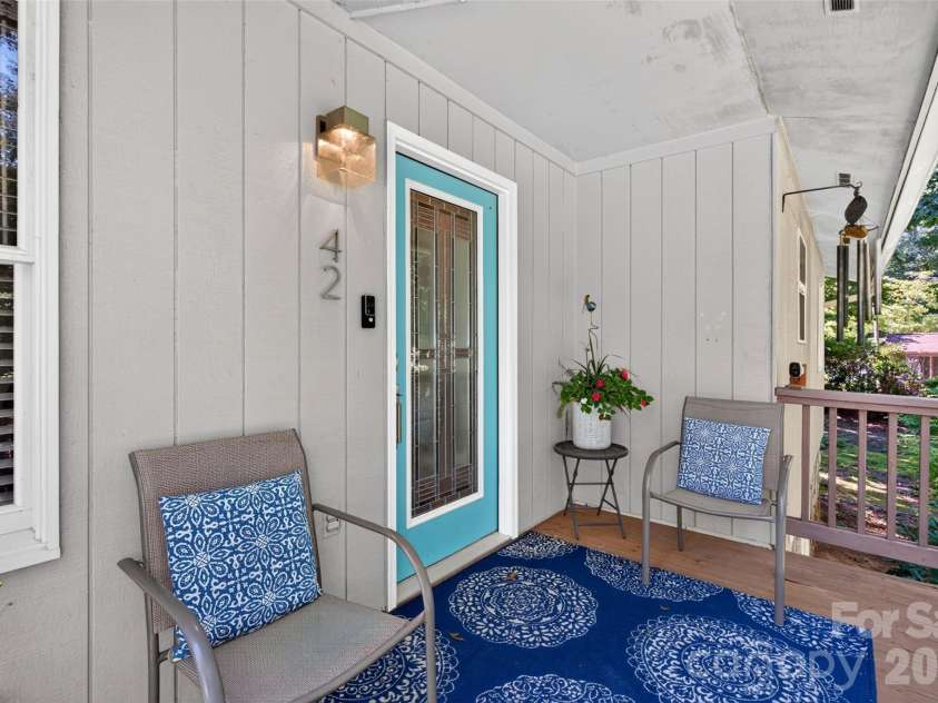 42 Timothy Lane, Candler, NC 28715.  MLS# CAR4419868, YatesRealty ID 47953. Nice eave overhang keeps the rain at bay