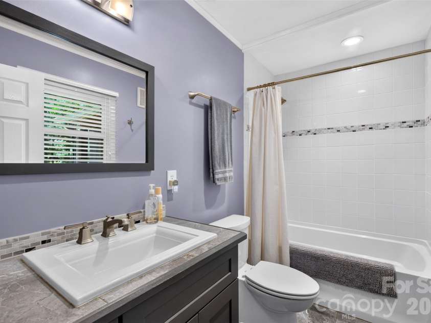 42 Timothy Lane, Candler, NC 28715.  MLS# CAR4419868, YatesRealty ID 47953. Secondary bathroom finishes were designed with thought also