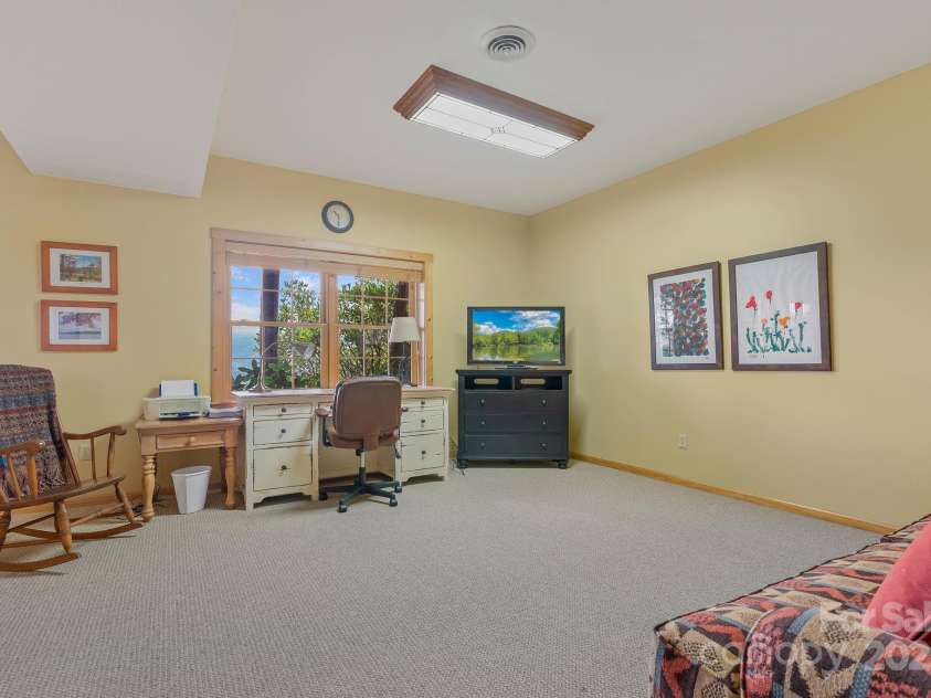 90 Forest Ridge Road, Burnsville, NC 28714.  MLS# CAR4176437, YatesRealty ID 4796. Basement Family Room