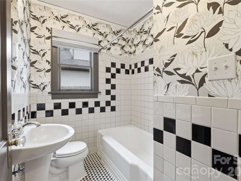 3407 Benard Avenue, Charlotte, NC 28206.  MLS# CAR4414465, YatesRealty ID 47981. Full bathroom featuring distinctive character and timeless tilework.