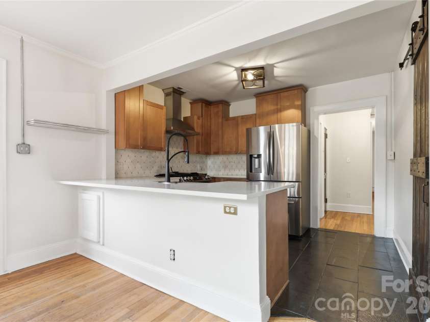 3407 Benard Avenue, Charlotte, NC 28206.  MLS# CAR4414465, YatesRealty ID 47981. Quality cabinetry provides attractive and practical kitchen storage.