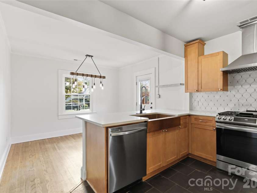 3407 Benard Avenue, Charlotte, NC 28206.  MLS# CAR4414465, YatesRealty ID 47981. Quality cabinetry provides attractive and practical kitchen storage.