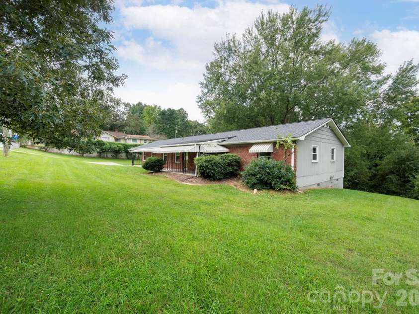 483 Caribou Road, Asheville, NC 28803.  MLS# CAR4417603, YatesRealty ID 47992. Facing house - right side
