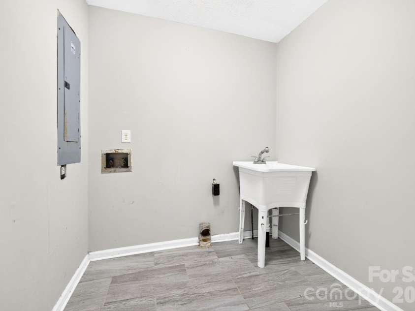 483 Caribou Road, Asheville, NC 28803.  MLS# CAR4417603, YatesRealty ID 47992. Laundry room