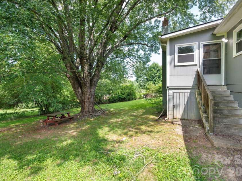 483 Caribou Road, Asheville, NC 28803.  MLS# CAR4417603, YatesRealty ID 47992. Mudroom access to back yard